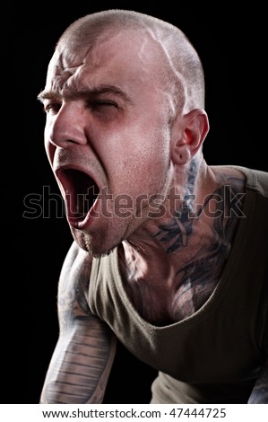 stock photo Screaming Man with tattoos