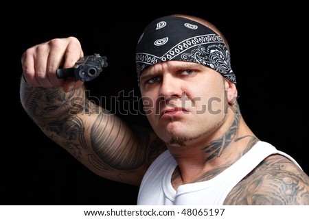 stock photo Tattooed gangster with gun