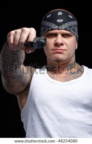stock photo : Tattooed gangster with gun