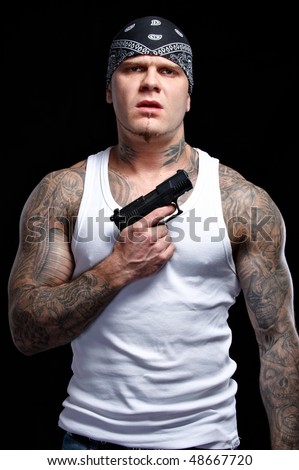 Gangster Clown Tattoo stock photo : Tattooed gangster with gun