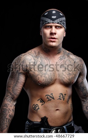 stock photo Tattooed gangster with gun