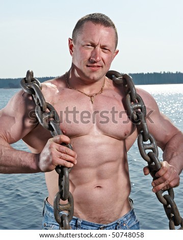 Muscular man with big chain
