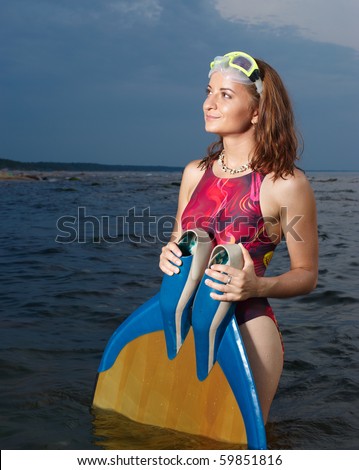 Portrait of cheerful young woman. Free Diver at sea.
