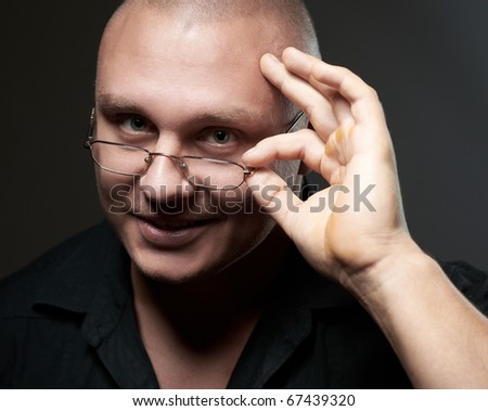 Positive portrait of serious man in eyeglasses