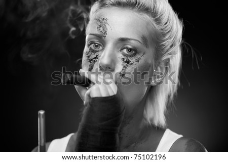Attractive blonde smoker girl, studio shot, black and white