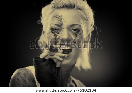 Attractive blonde smoker girl, studio shot, sepia