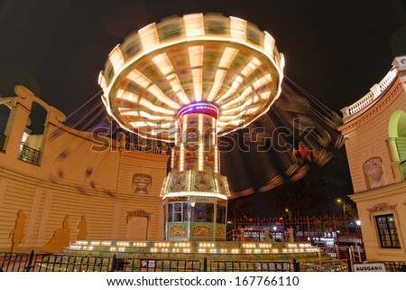 VIENNA, AUSTRIA - NOVEMBER 23: Carousel in motion at the Prater Amusement park at night on November 23, 2013 in Vienna, Austria.