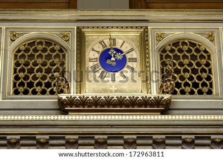 VIENNA, AUSTRIA - NOV 22, 2013: Clock in the Council Chamber of  Vienna City Hall. in this hall the members of the City Council and Diet convene. The assembly is composed of 100 members.