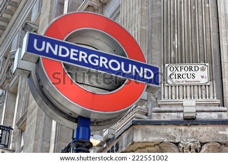 LONDON - JULY 1, 2014: London underground sign at Oxford Circus Station, with the focus on the Oxford Circus sign.