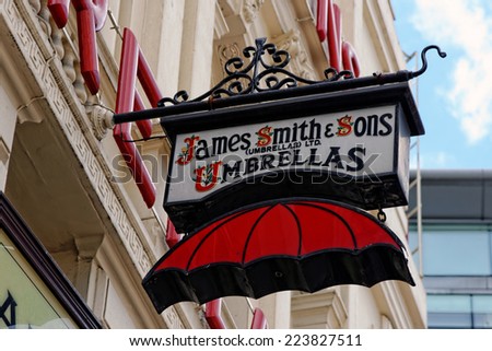 LONDON, UK - JULY 1, 2014: The famous James Smith and Sons Umbrella shop sign on New Oxford street. Founded in 1830 it is a stunning reminder of the Victorian period.