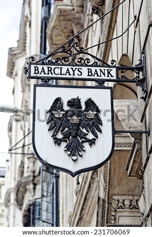 LONDON - JULY 1, 2014: Vintage sign of Barclays bank branch in the City of London. Barclays was founded in 1690 and currently employs 146,100 staff (2011).