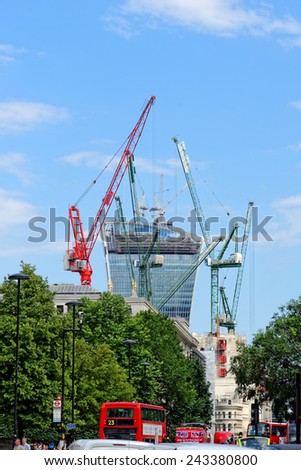 LONDON, UK - JULY 1, 2014: The City\'s new giant office tower under construction on 20 Fenchurch Street, generally known as the \'Walkie Talkie\' because of its shape.