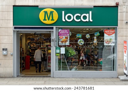 LONDON, UK - JULY 1, 2014: The exterior of a Morroson local supermarket on a street in central London. Morrison is the fourth largest chain of supermarkets in the UK with headquarters in Bradford.
