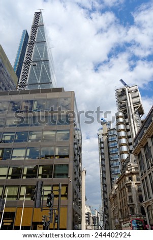 LONDON, UK - JULY 1, 2014: The famous office buildings - The Cheesegrater (Leadenhall Building) and the Lloyd\'s Building in the City of London, one of the leading centers of global finance.
