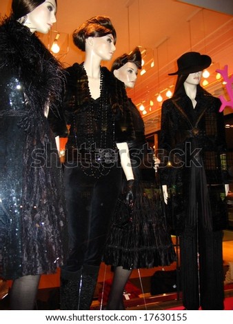 Mannequins on a shop-window displaying the latest fashion