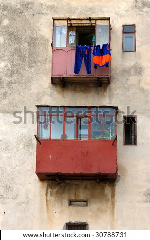 Old house and balcony with hanged clothes