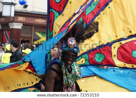 LONDON - AUGUST 30: A man takes part in the parade at the Notting Hill Carnival on August 30, 2010 in London