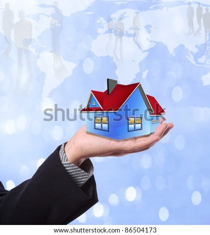 The House in the hands against the world map and business network  as a symbol of the real estate business.