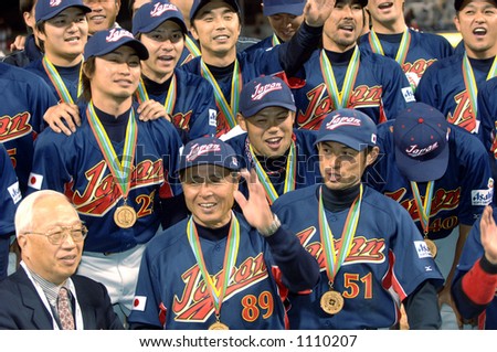 Team Japan poses for pictures during celebrations following their 10-6 victory over Cuba to win the 2006 World Baseball Classic at Petco Park in San Diego March 20, 2006.