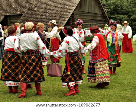 JEKABPILS, LATVIA - JULY 14: unknown women group dancing in national clothes at the Song Festival - Chervona Kalina VI on July 14, 2012 in Selu seta, Jekabpils, Latvia