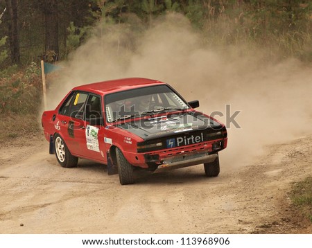 JEKABPLIS, LATVIA-SEPTEMBER 22: Rimants Kalnins and Janis Silins drives Audi 80 during a motoring event Rally sprint Viduslatvija 2012 in Jekabpils, Latvia on September 22, 2012.