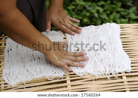 woman making noodles in south east asia