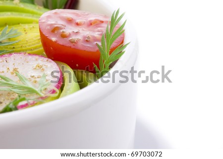 fresh spring salad in bowl with vinegar dressing