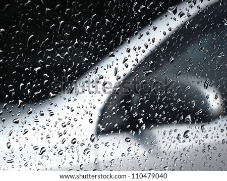 car window after rain (with water drops) and other car as a background