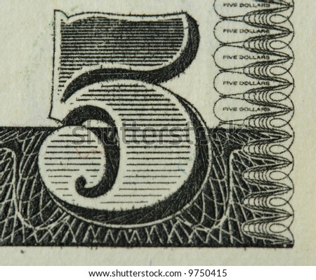 Fragment of five dollars bill with figure five (close-up).