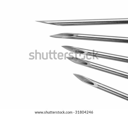 Close-up of surgical needles on white background (isolated on white)