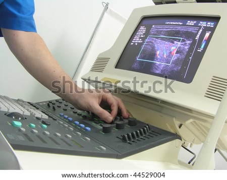 doctors hand and ultrasound machine