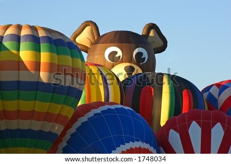 Smokey the Bear balloon peeking over the pack at the Albuquerque International Balloon Fiesta 2004.