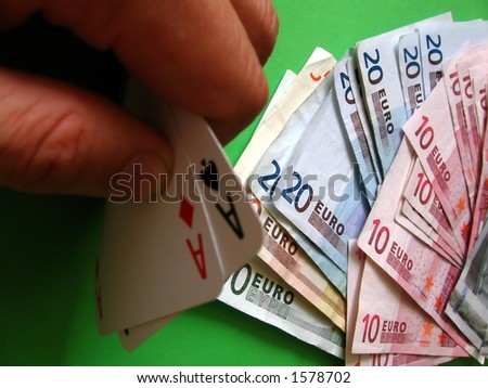 cards and money;  two aces win;  money 10, 20, 50, 100 euro;  green backgroud