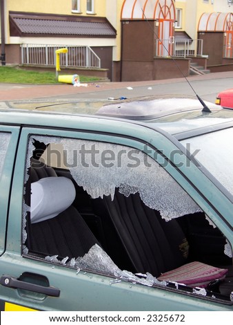 bad day for owner car - vandal or thief or accident - destroyed window-pane, probably vandal destroyed window-pane and wastepaper basket