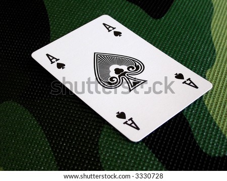 ace spade on the camouflage pattern, concepts: game, poker, hidden card, cheat at cards, war game,