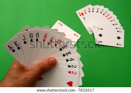 playing bridge - one hand (A,K,J,10,6 spades, 2 heart, A,Q,10 diamonds, A,K,4,2 clubs),  on table other \