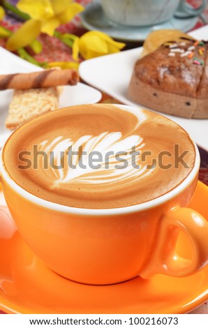 Cappuccino with latte art on the cream