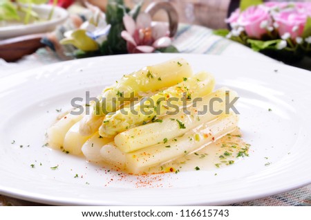 Tasty white asparagus on white plate