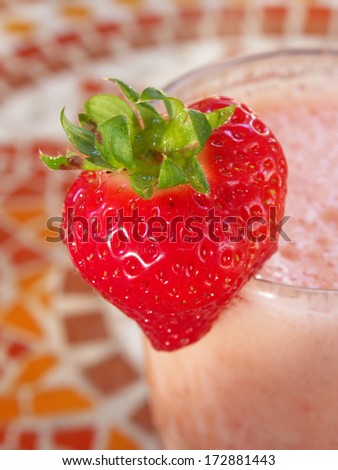Strawberry shake in a glass decorated with a strawberry