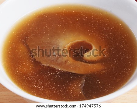Closeup of a bowl of shark fin soup.