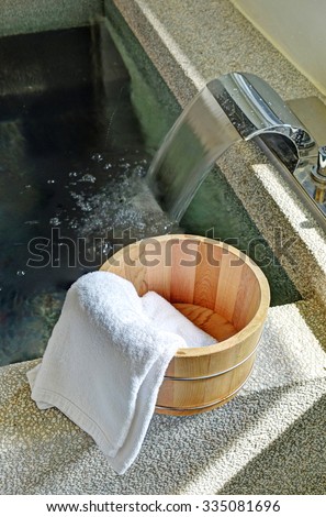 Bath bucket with a towel at a hot spring bath at Japanese onsen