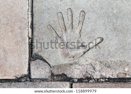 Hand Print - A hand print in cracked cement