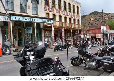 VIRGINIA CITY, NV JUNE 6, 2015: Motorcycles park along the street amid old western buildings during the seventh annual public Street Vibrations Spring Rally in Virginia City, Nevada on June 6, 2015.