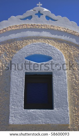 window on the side of a greek church