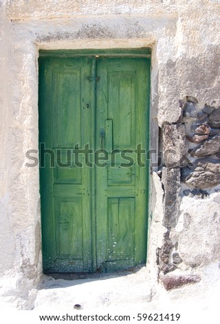 rustic green doors on Santorini, Greece