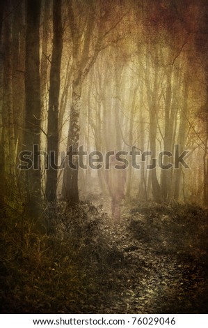 heavily textured and toned abstract image of a ghostly figure wandering down a woodland path