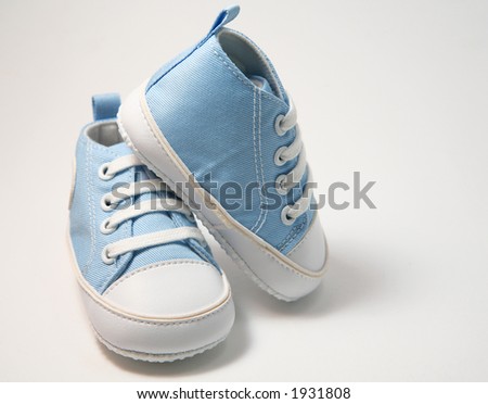 Blue baby shoes on white background