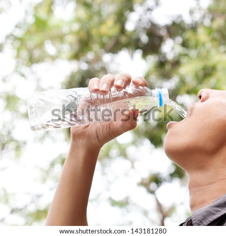 Man drinking from water bottle