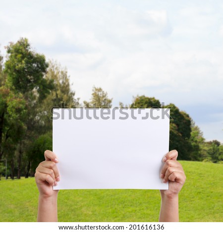 Woman holding empty paper