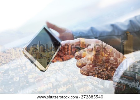 Double exposure of hand touch screen on smartphone.